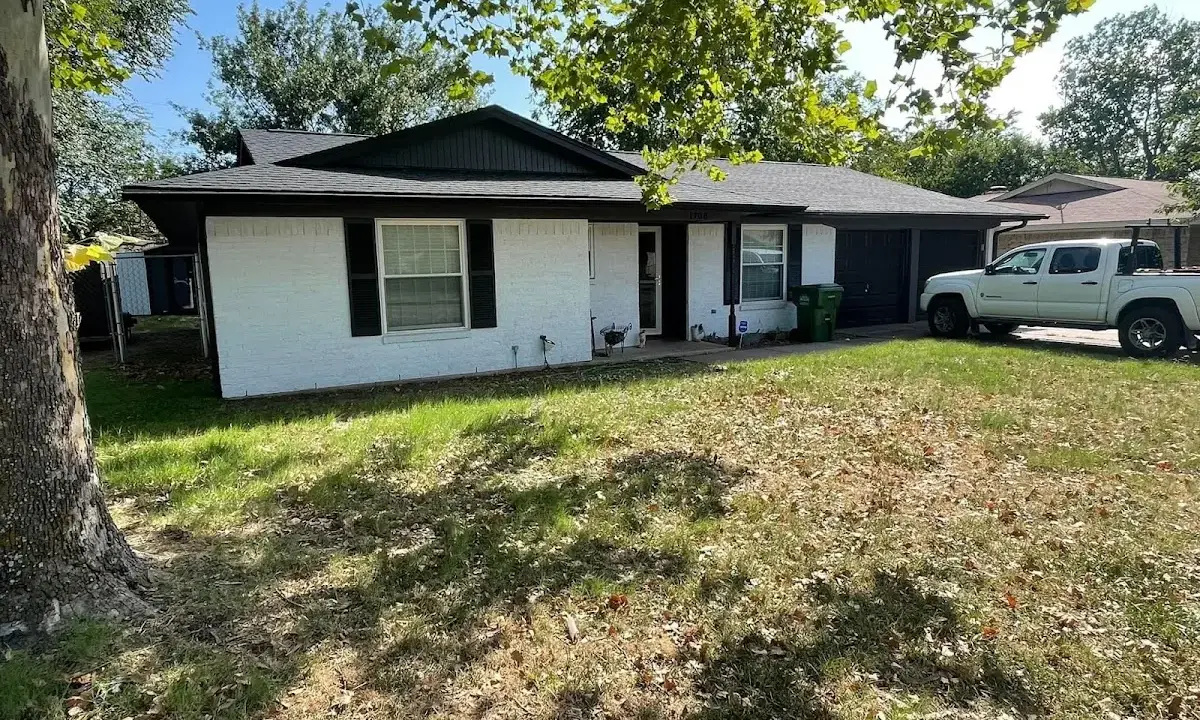 Professional roofing crew working on a residential roof in Kiryas Joel